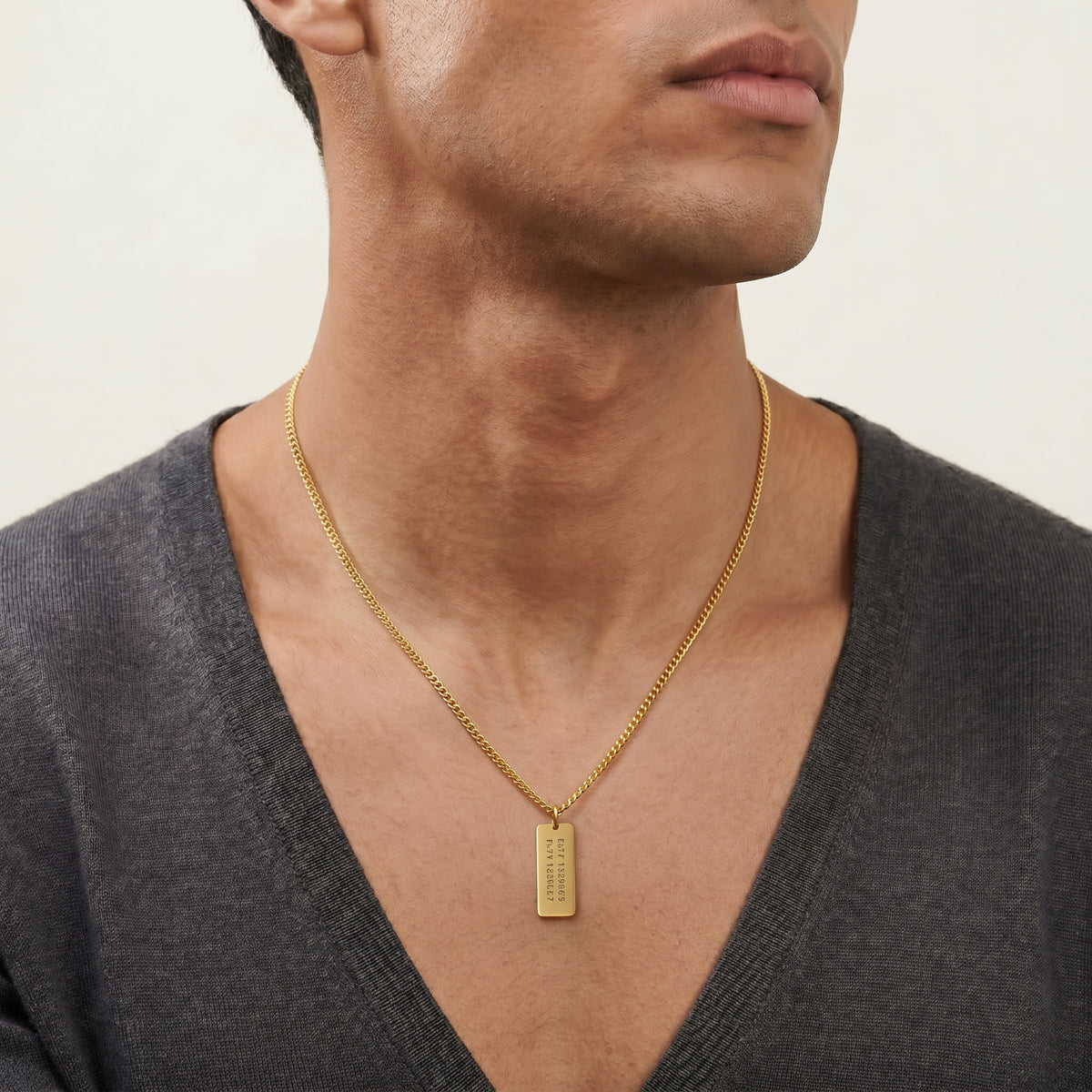 Customized Gold Bar Name Necklace worn by a human model