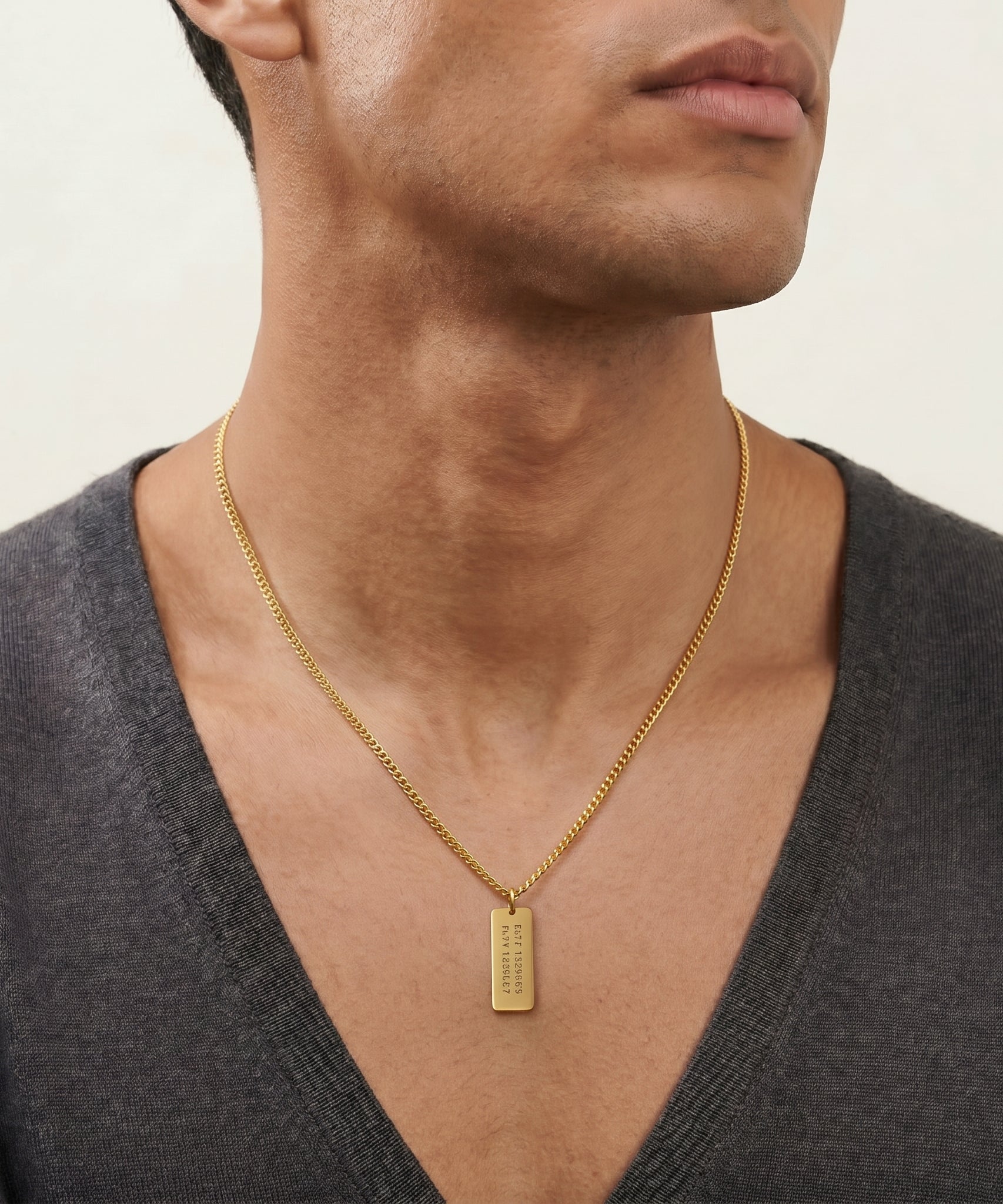 Customized Gold Bar Name Necklace worn by a human model