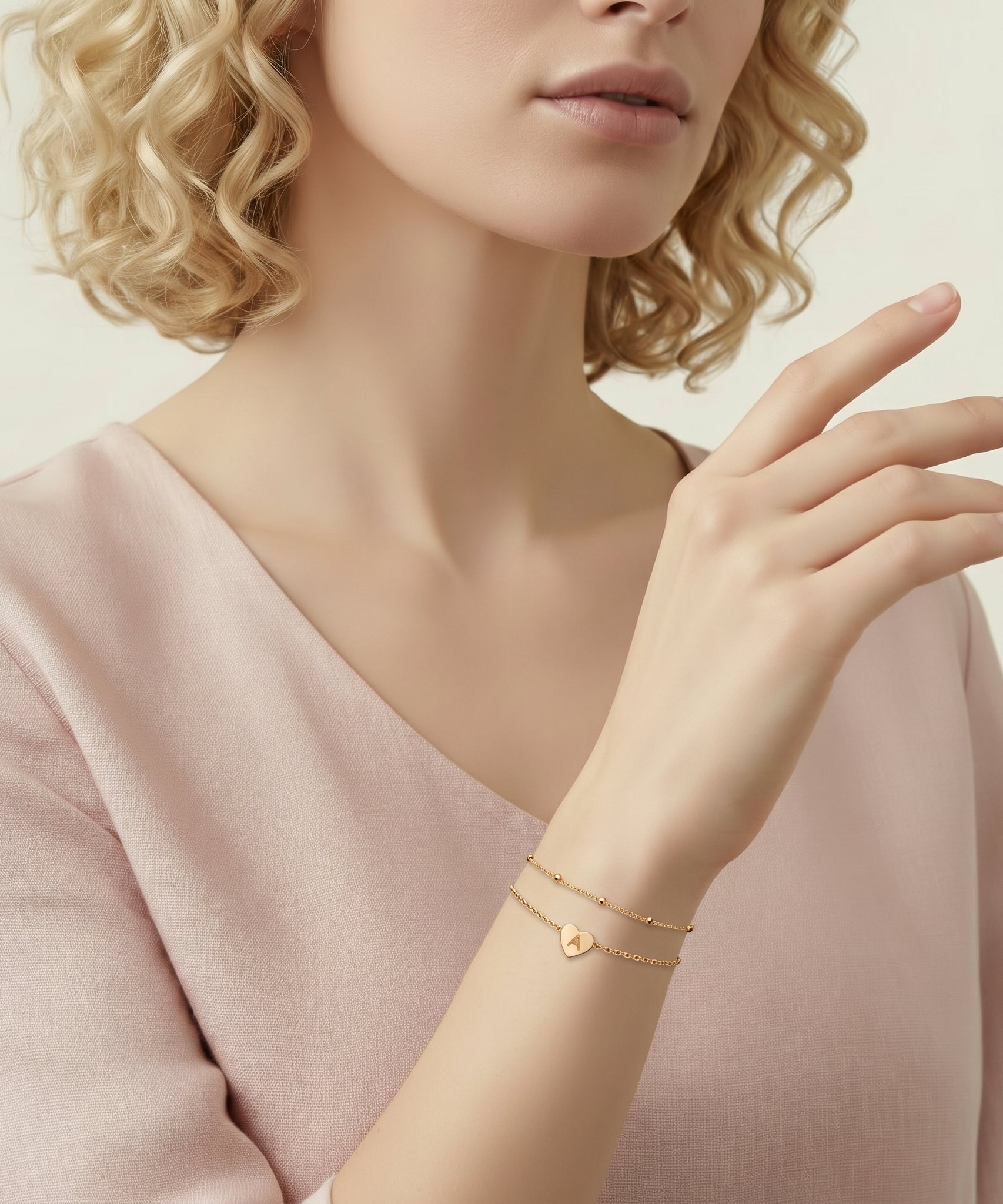 Customized Peach Heart One Letter Bracelet worn by a human model